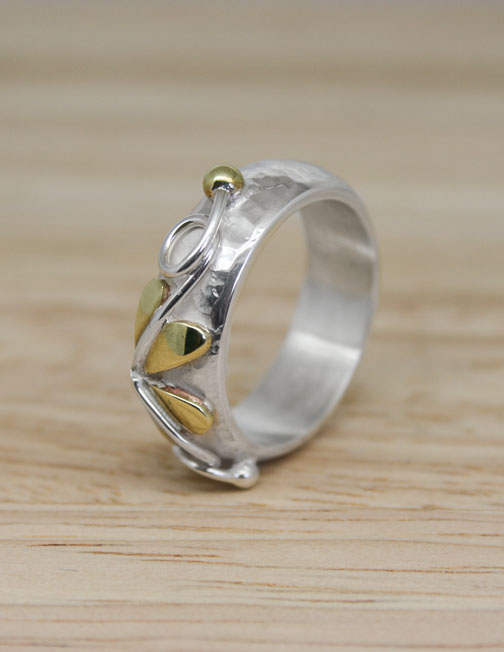 Sterling silver ring with brass detail