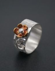 Sterling silver band ring with copper daisy and silver detail