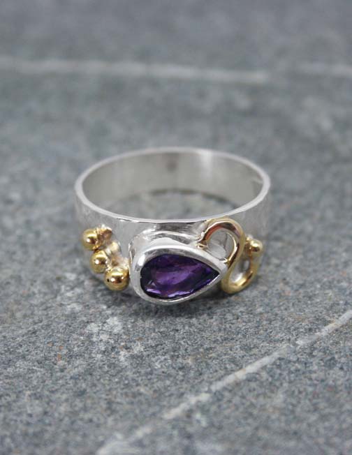 Pear shaped amethyst silver ring with brass detail