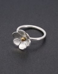 Silver flower ring with brass center