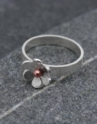 Silver flower ring with copper detail