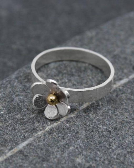 Silver flower ring with bronze detail