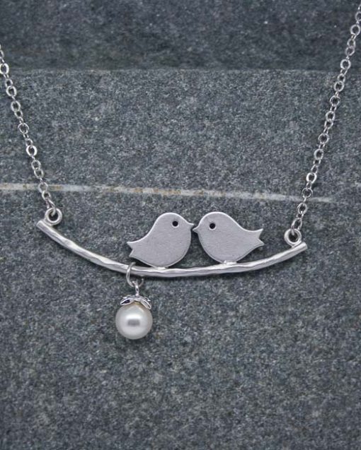 Two birds on a branch necklace with pearl drop