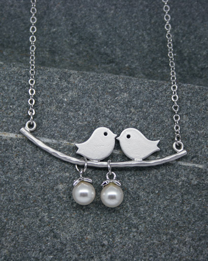 Two bird pearl necklace