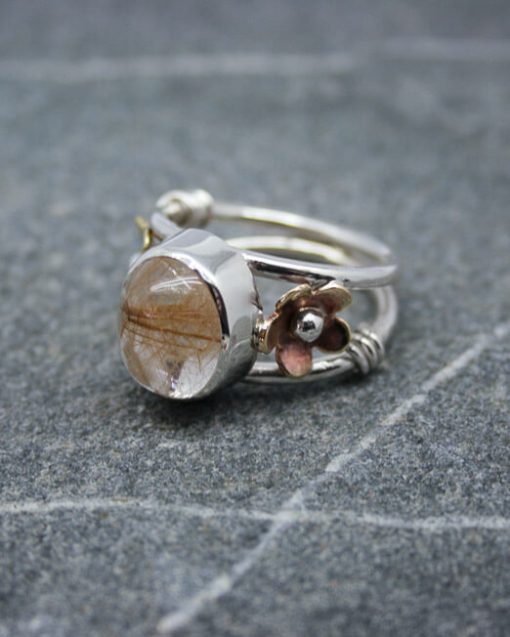 Cabochon rutilated quartz silver ring with bronze and brass detail