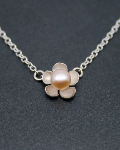 Single silver flower and pearl necklace