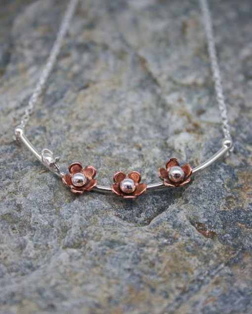 silver and copper daisy necklace with mouse