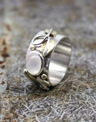 silver and moonstone ring with brass leaves and silver wire detail
