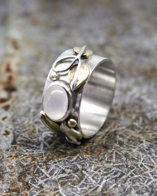 silver and moonstone ring with brass leaves and silver wire detail