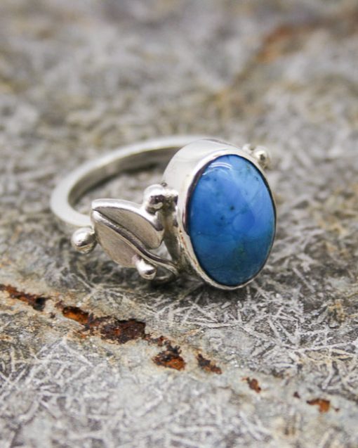 silver and turquoise ring with leaf shoulders