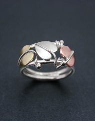 Silver, copper and brass three leaf ring