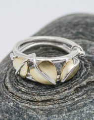 Silver ring with three brass leaves