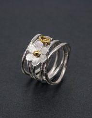 Wide silver daisy roller coaster ring