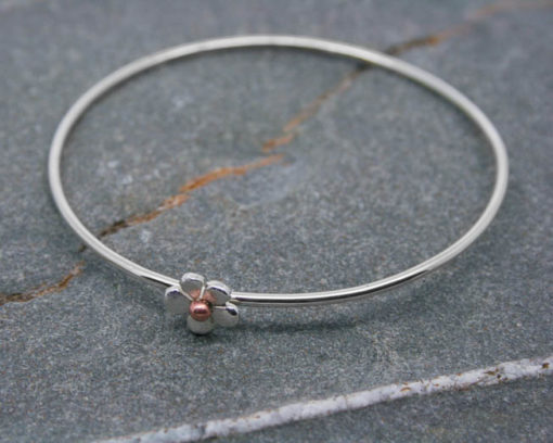 Sterling silver bangle with flower and bead